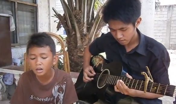 Phillippino Boy Sings “Dance with my Father Again”